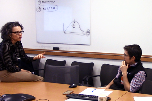 Women and man speaking in a meeting room Women and man speaking in a meeting room
